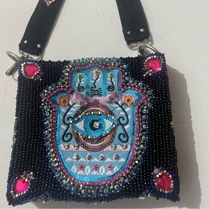 Hamsa beaded embroidered crystal evil eye purse protection Sara Molano